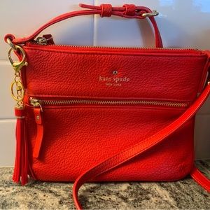 Woman’s Kate Spade, red soft pebbled leather crossbody.